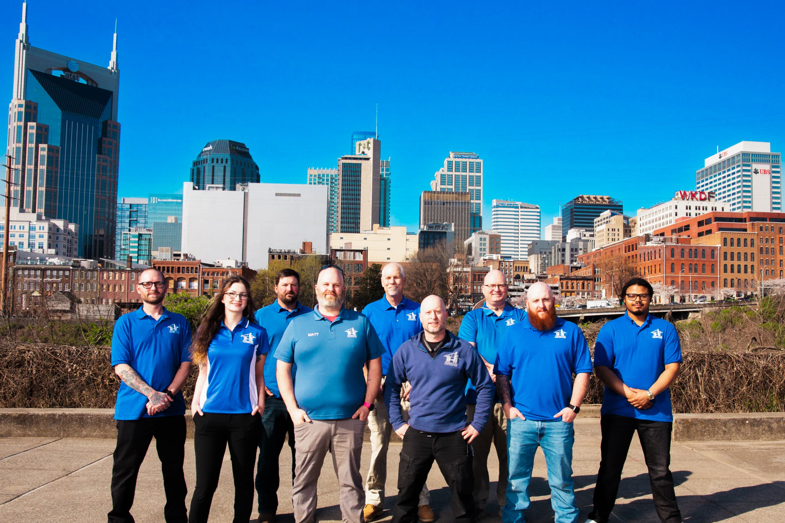 Team of licensed Tennessee home inspectors standing together in uniform, representing a professional home inspection company